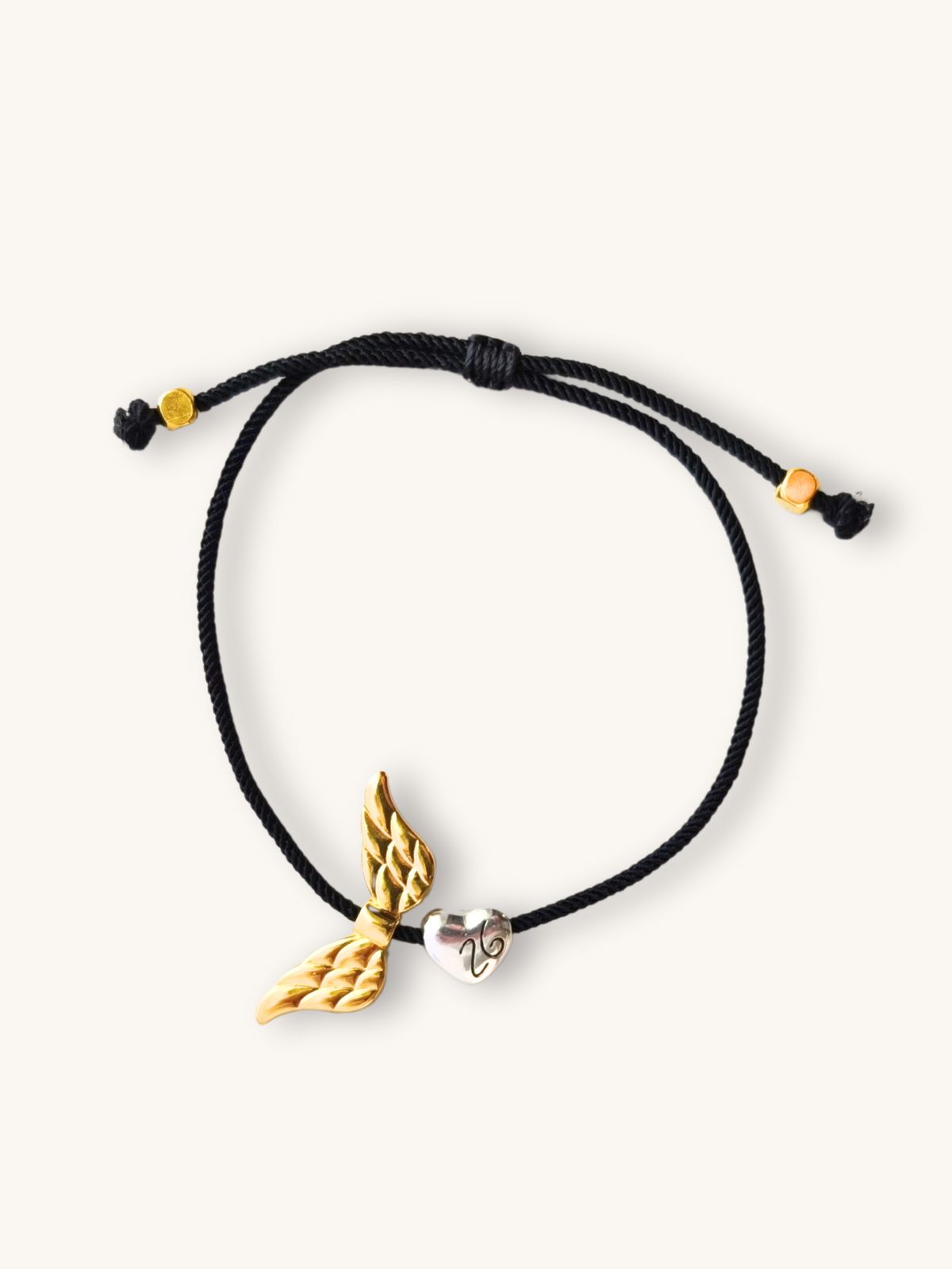 Βραχιόλι Γούρι ’26 με Χρυσά Φτερά Αγγέλου & Ασημί Καρδούλα | Couronne