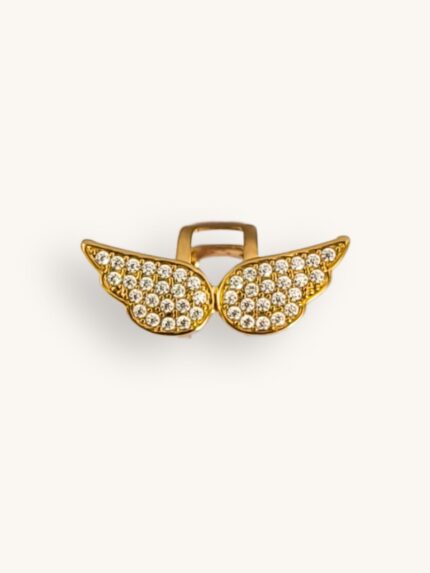 Χρυσό ear cuff από επιχρυσωμένο ατσάλι με σχέδιο φτερά αγγέλου και λαμπερά ζιρκονάκια.